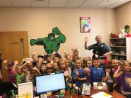 Class of children with police officer