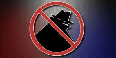 Criminal cartoon with a circle and a cross in front